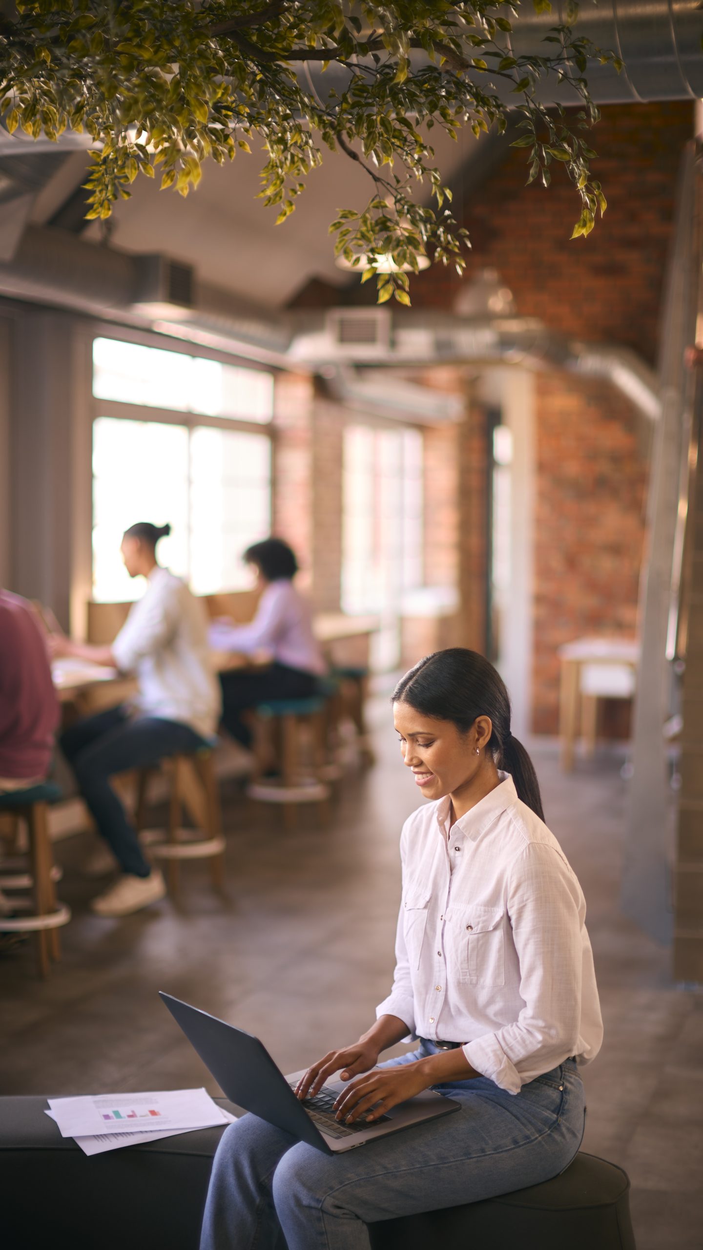 A woman who happens to be a high functioning borderline personality disorder working on a laptop