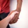 A histrionic personality disorder specialist shaking hands and treating someone with histrionic personality disorder