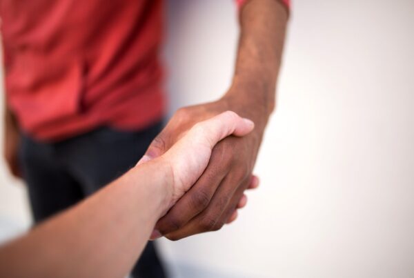 A histrionic personality disorder specialist shaking hands and treating someone with histrionic personality disorder